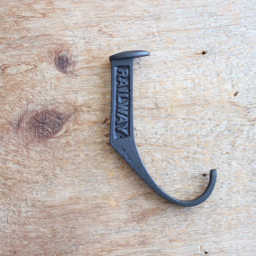 Black railway inscribed metal single hook.