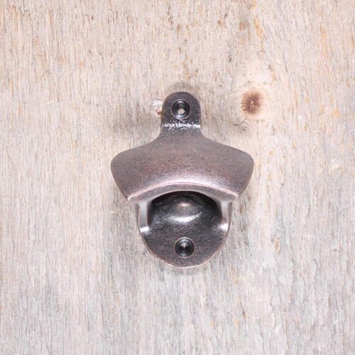 Ouvre Bouteille en fonte cuivre antique