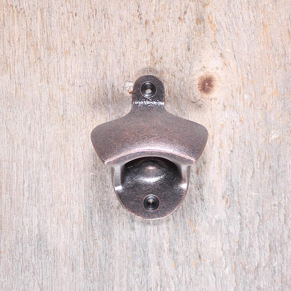 Ouvre Bouteille en fonte cuivre antique