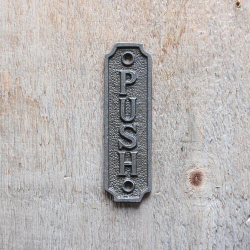 Plaque en fonte push